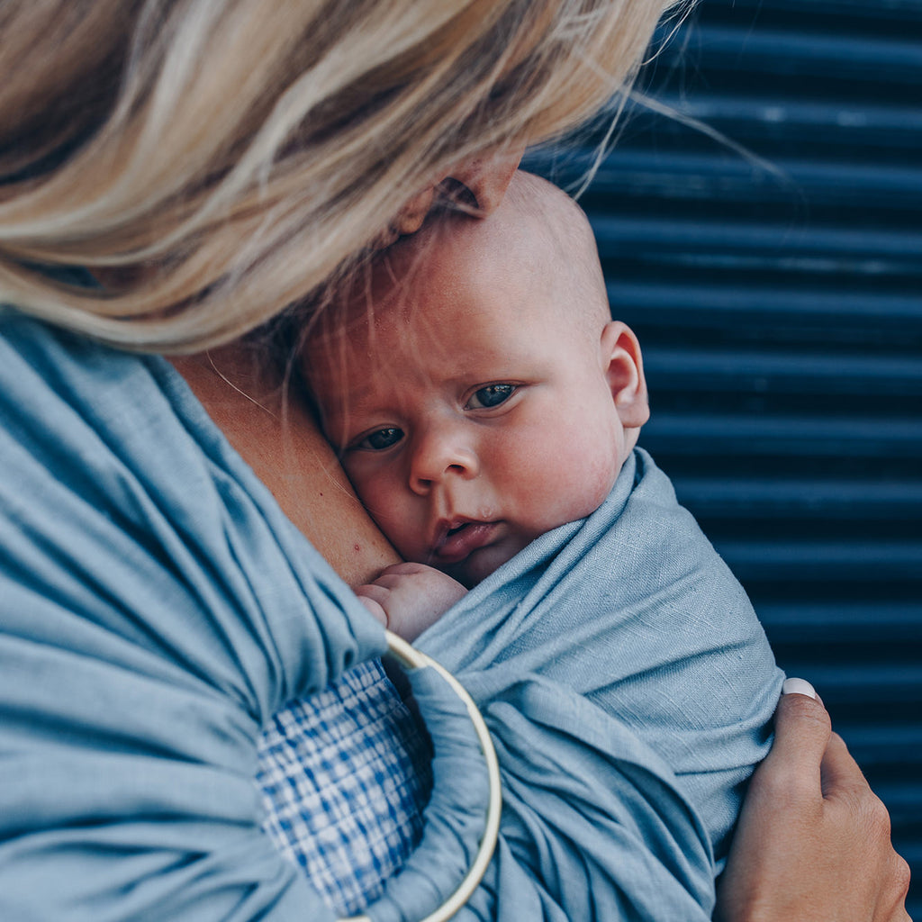 How to Position Your Baby Properly in a Ring Sling (And Why It Matters)